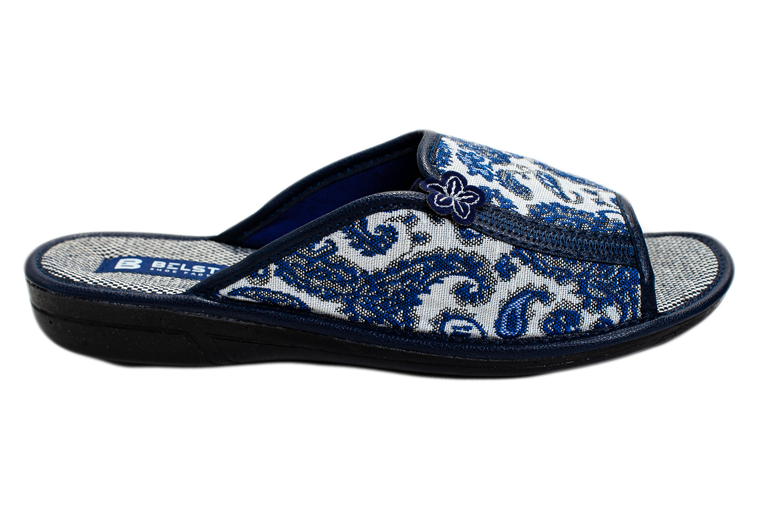 Women's open home slippers made of white textile with a patterned print, decorated with a flower